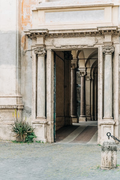 An ornate marble entrance to a condominium in Rome, Italy