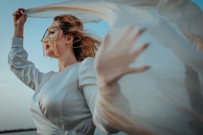 Woman in white dress shirt wearing eyeglasses