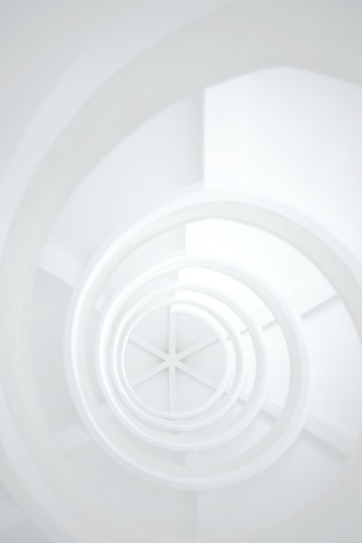 Fascinated by the exterior, I went into the tower to capture the spiralling nature of the stairs. 
-
Tactfully adjusted, lifting the whites, simulating a state of elegance and purity