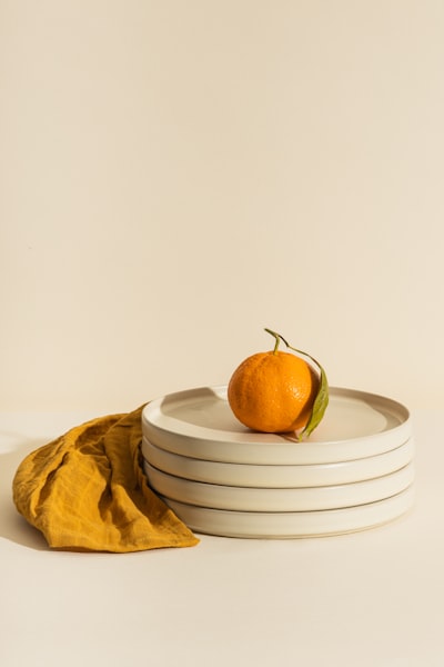 Yellow apple fruit on white round plate