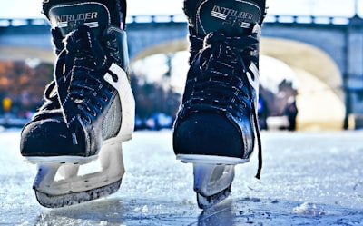 Ice skates close-up on frozen pond