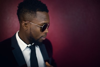 Elegant man near a red wall