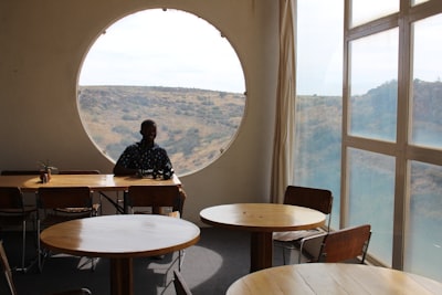 Man sitting on chair near window