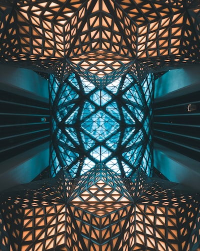 This is the lift lobby at the City of Dreams hotel in Macau. The moment I looked up I saw this surreal, geometric sight and had to capture it.