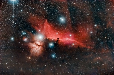The Horsehead and Flame nebulas captured with a telescope and a defiltered camera.