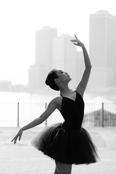 Woman in black spaghetti strap dress