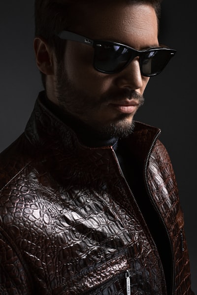 Man wearing black leather jacket and sunglasses