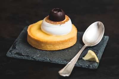 Pastry with cream and spoon