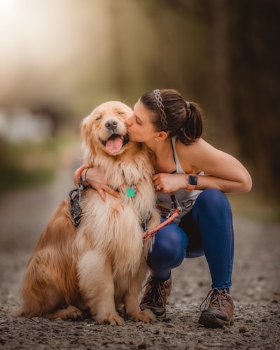 This is my beautiful wife kissing our Golden retriever Oakley. As you can see, this little boy is so happy in this moment. 