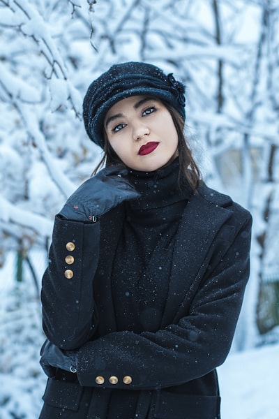 Woman in black knit cap and black jacket