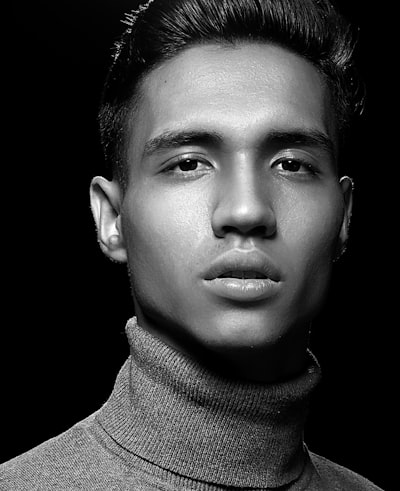Grayscale photography of man in turtle neck top