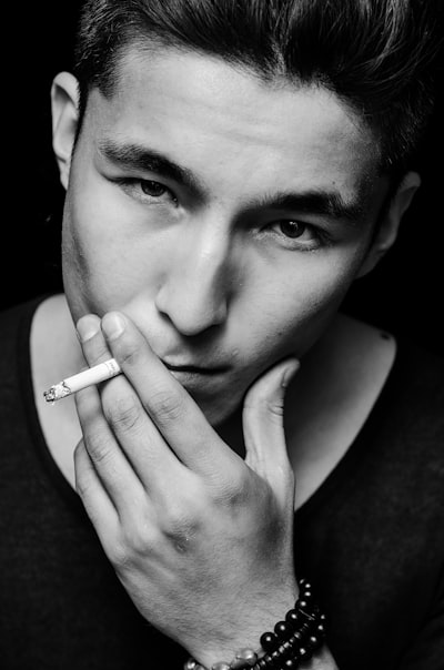 A man with a cigarette in his hand