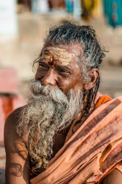 Selective focus photograph of man in orange outfit
