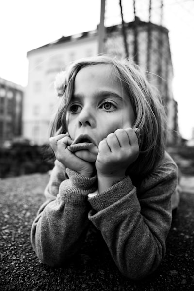 Grayscale photo of girl doing face palm