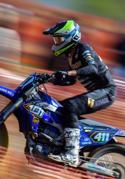 A man riding a dirt bike on a track