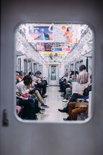 People at the train looking at their phones