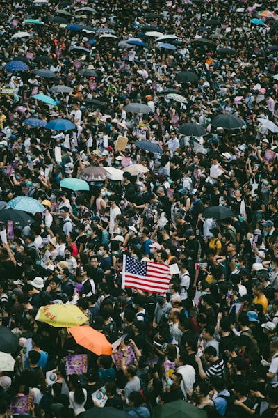 Tens of thousands of protesters waving US flags marched on Hong Kong's US Consulate to call for help from the Trump administration in ending a three-month confrontation with the government, calling for the passing of the proposed 