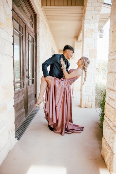 A man riding on the back of a woman