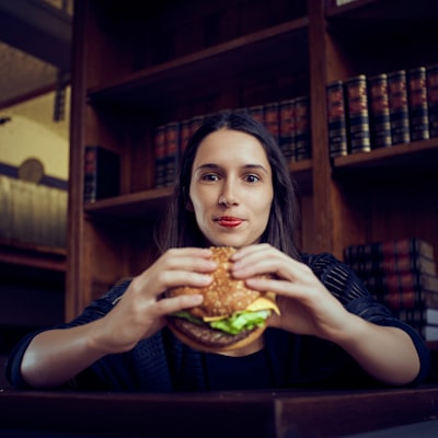 Woman holding hamburger