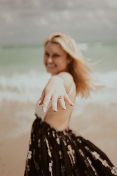 Woman showing silver-colored ring