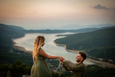 Hilltop proposal overlooking river valley at sunset