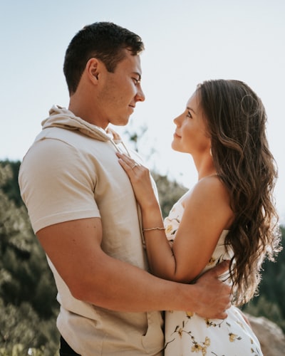 Man and woman kissing during daytime