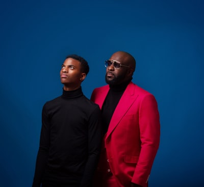Black father and son in fuchsia suit