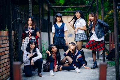 Group of female in school uniform.