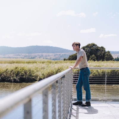 Man leaning on railing 