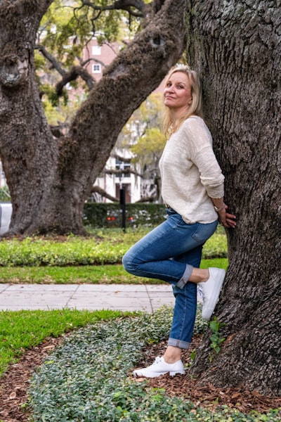 A woman sitting on a bench in a park